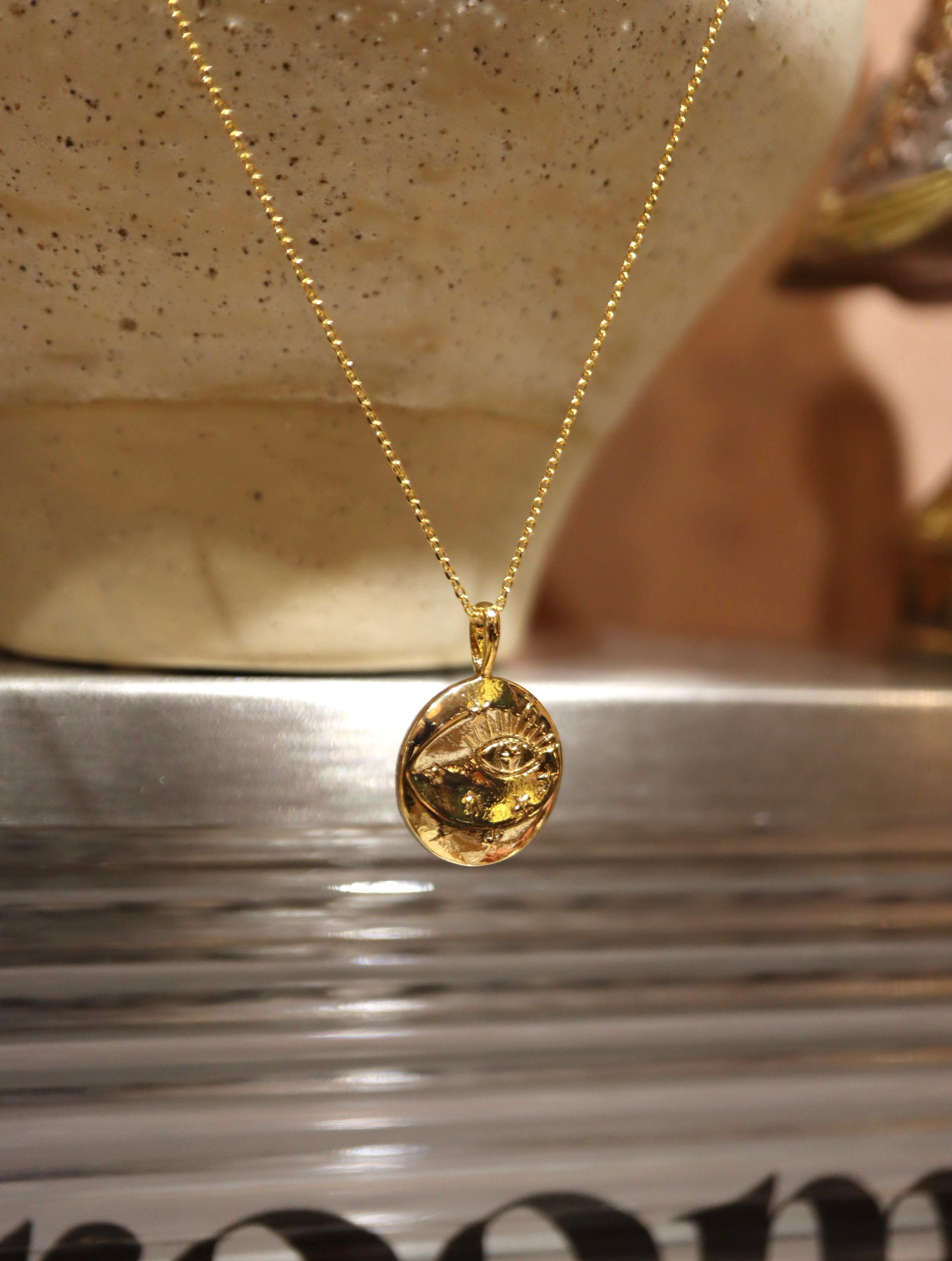 Eye coin brass necklace