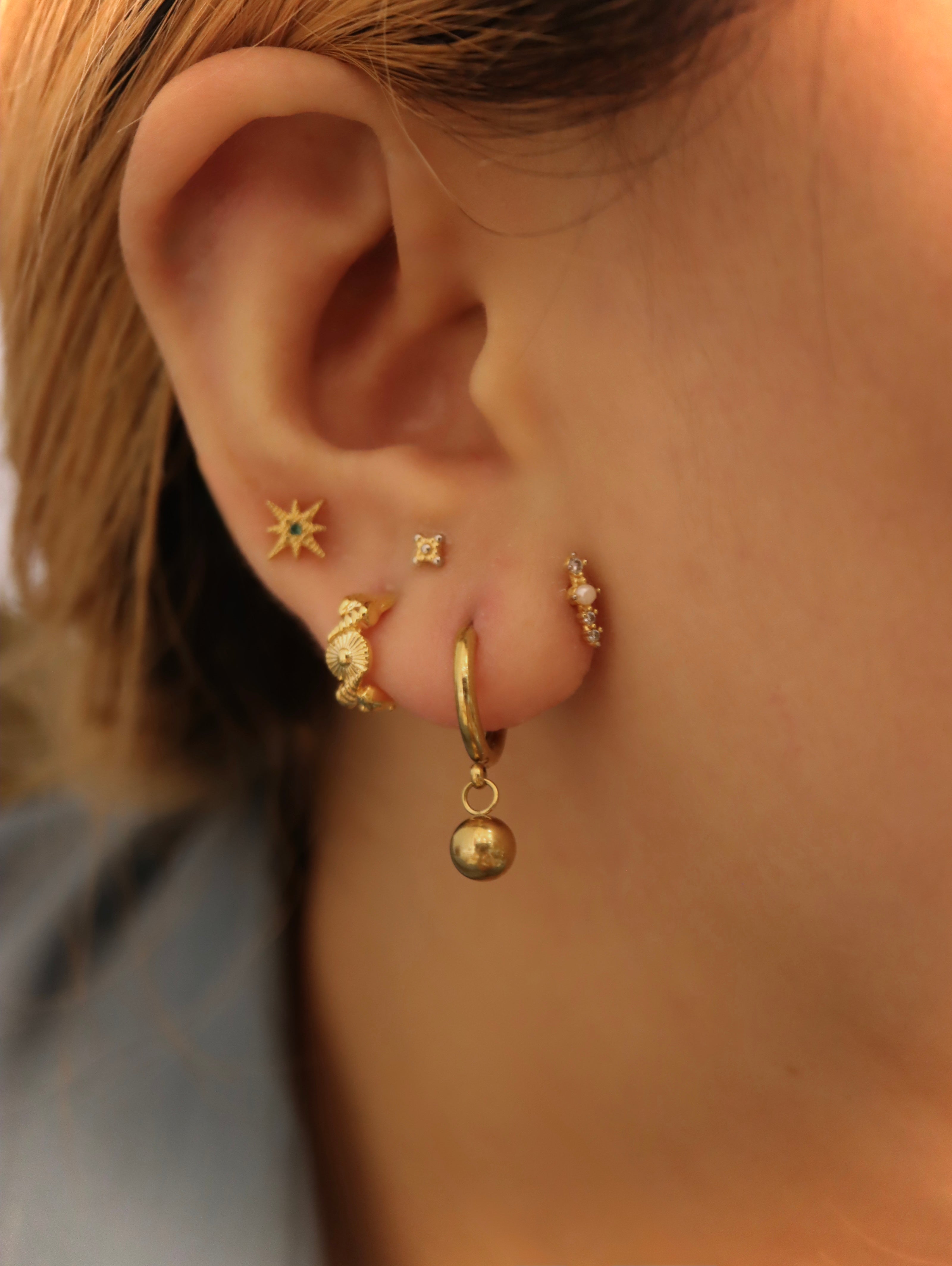 Solis textured hoop brass earrings
