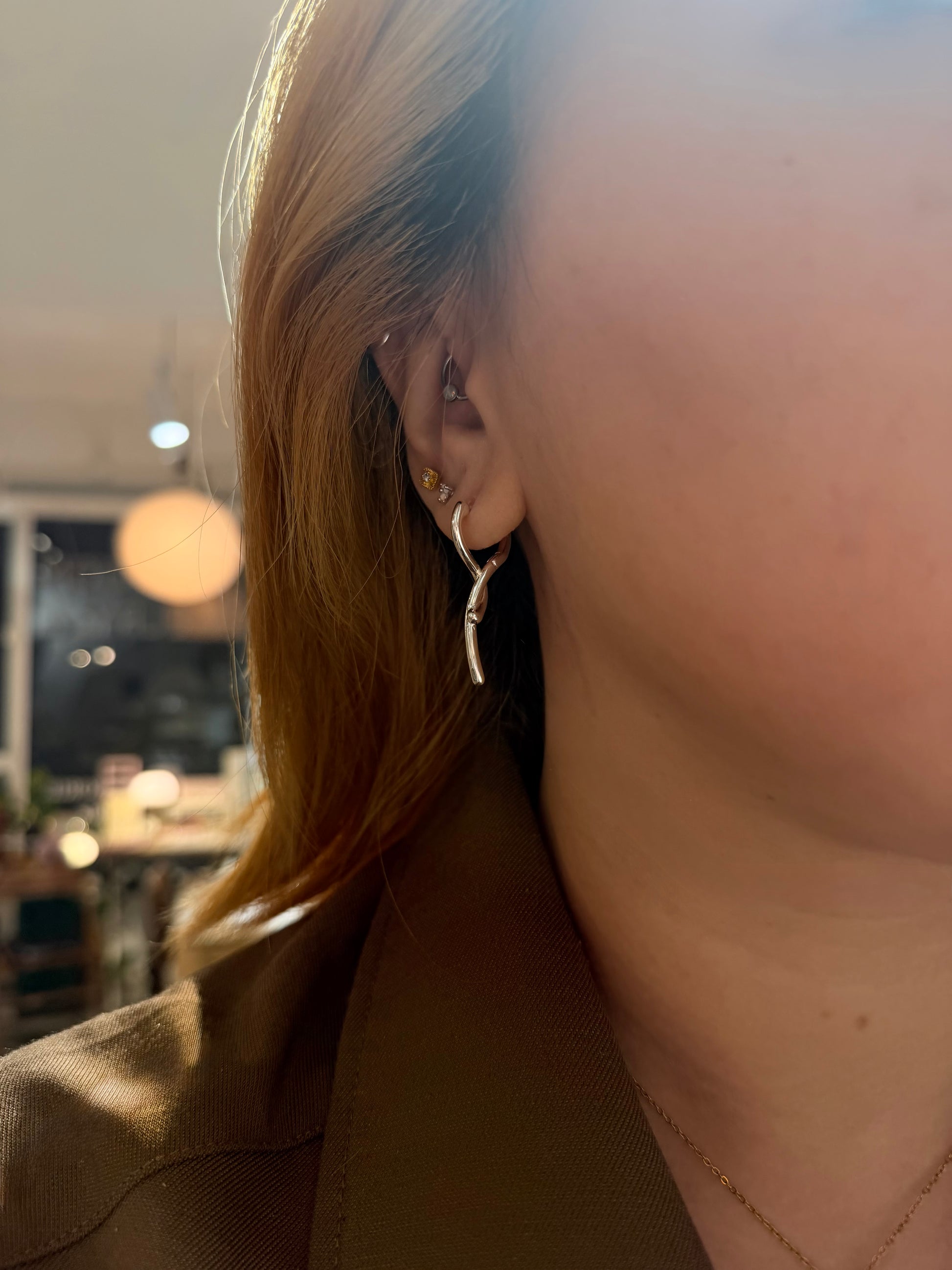 Twisted shiny silver brass earrings