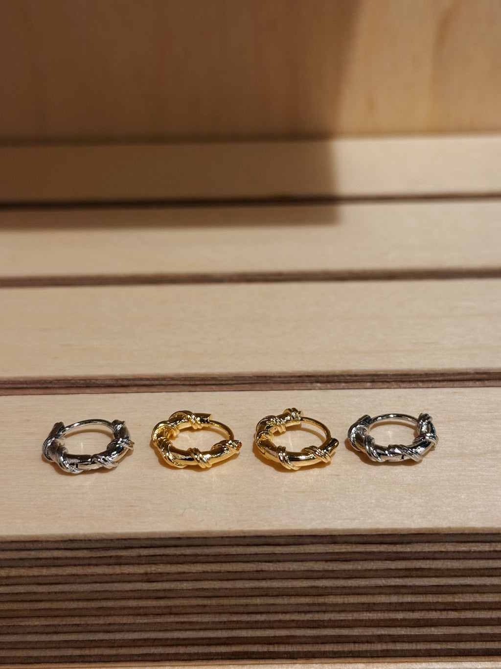 Hinged hoop rope earrings