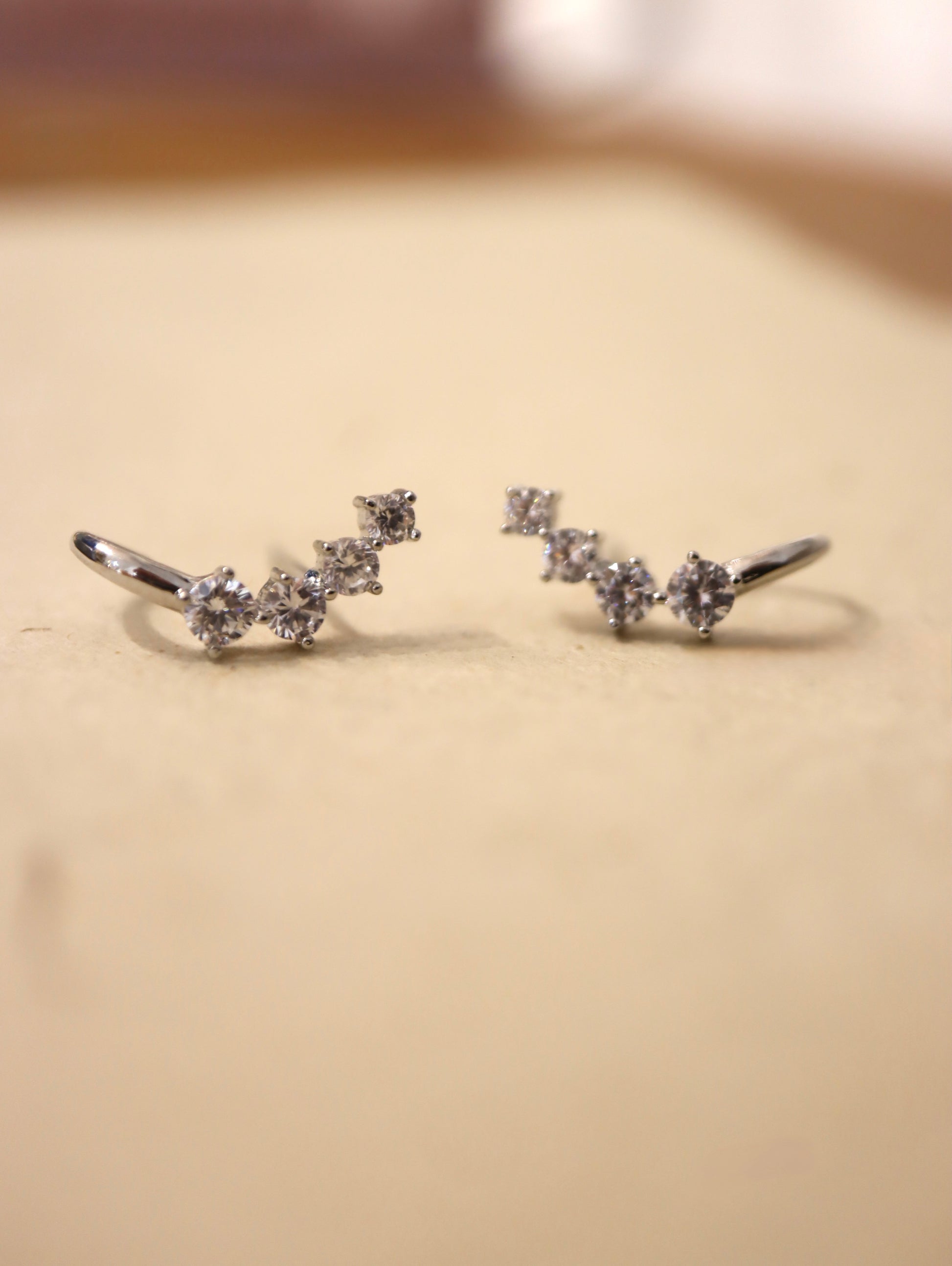 Curved cz brass earrings