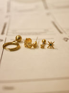 Solis textured hoop brass earrings