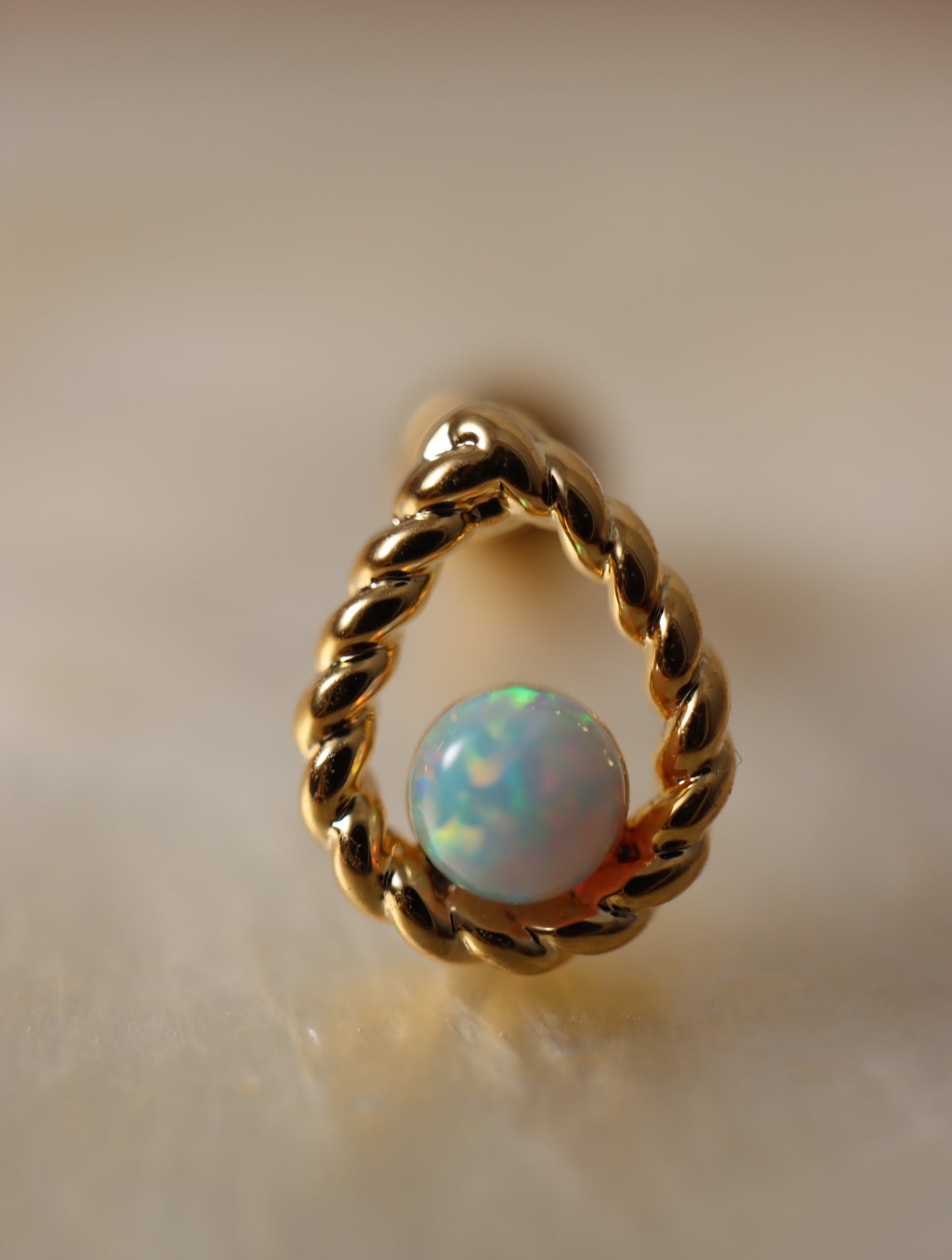 Teardrop opal screw ball piercing