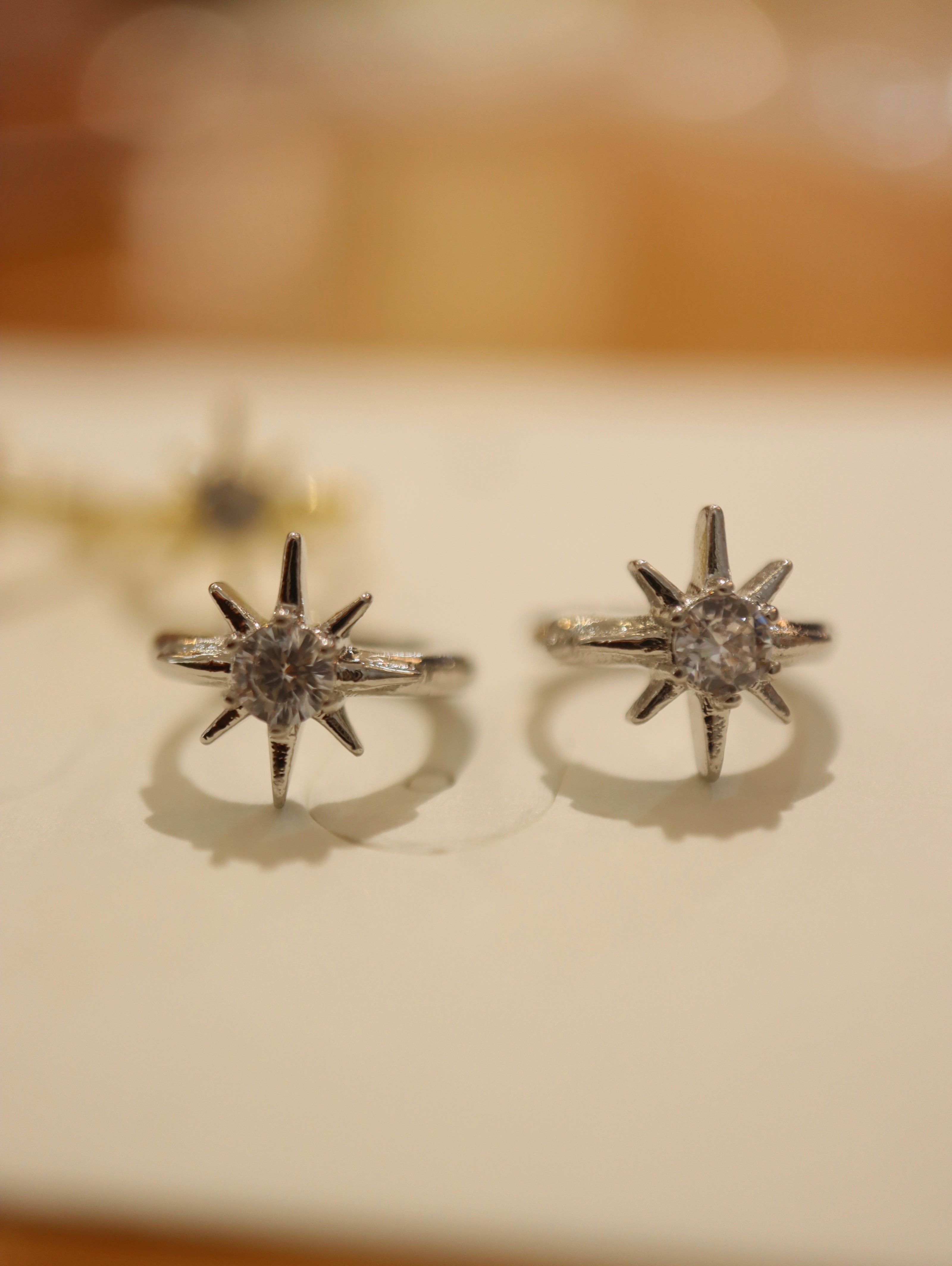 Solaris Star Hinged Hoop Earrings
