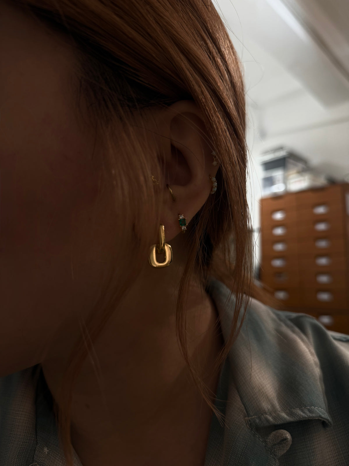 Interlock brass earrings