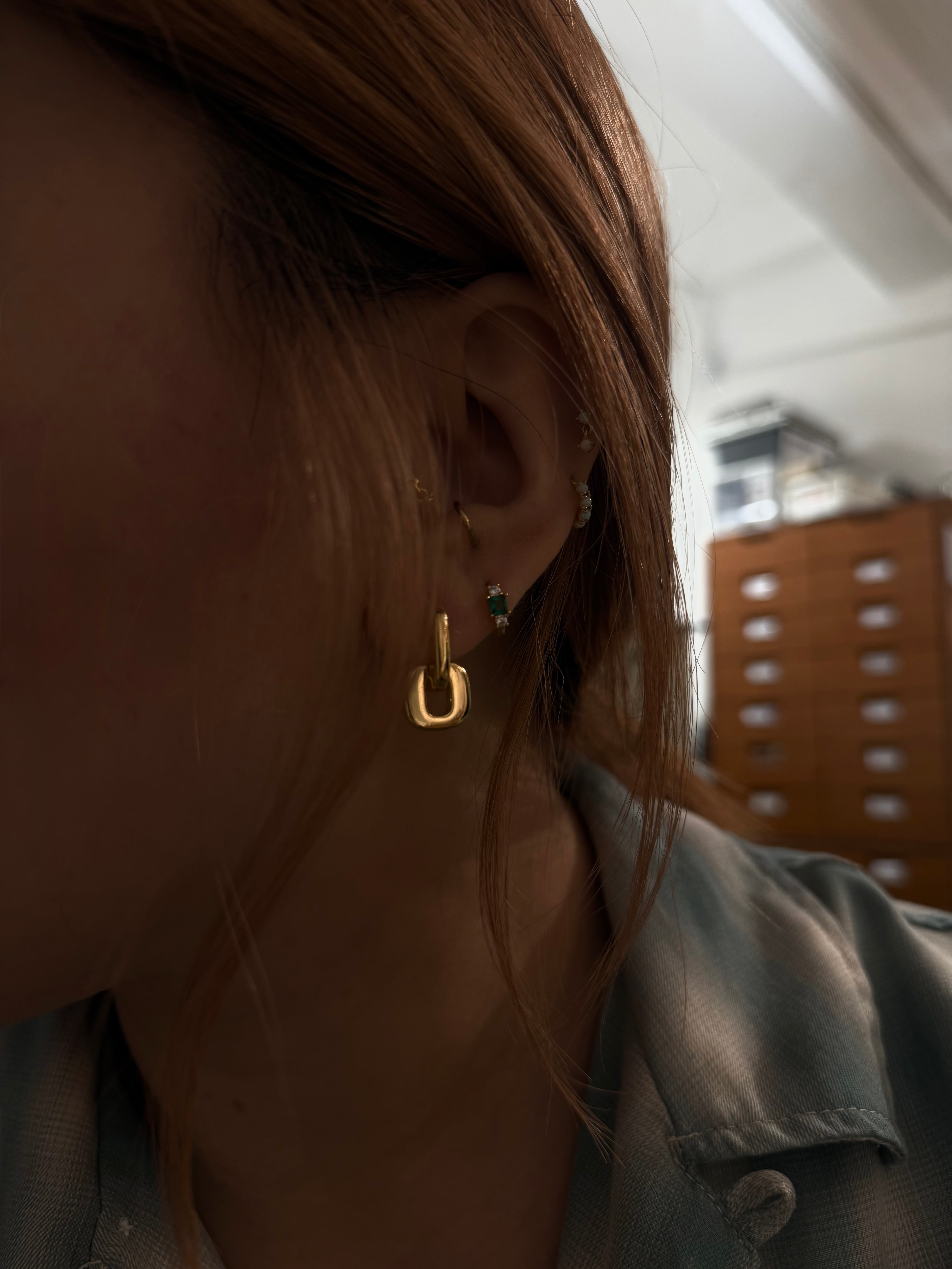 Interlock brass earrings