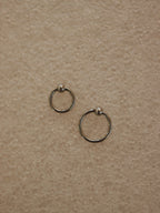 Surgical steel captive bead clicker