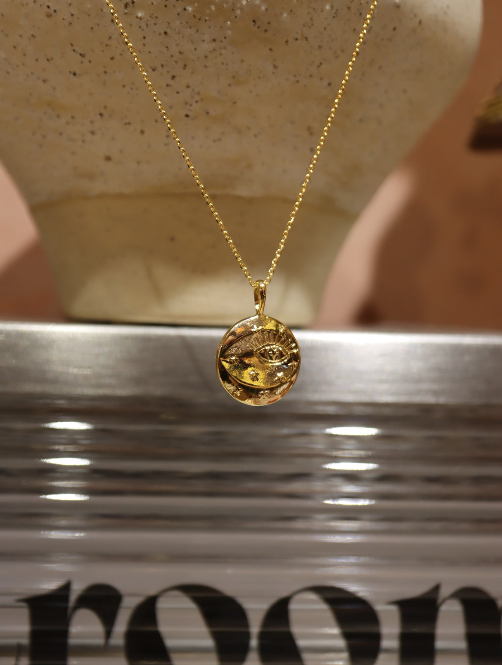 Eye coin brass necklace