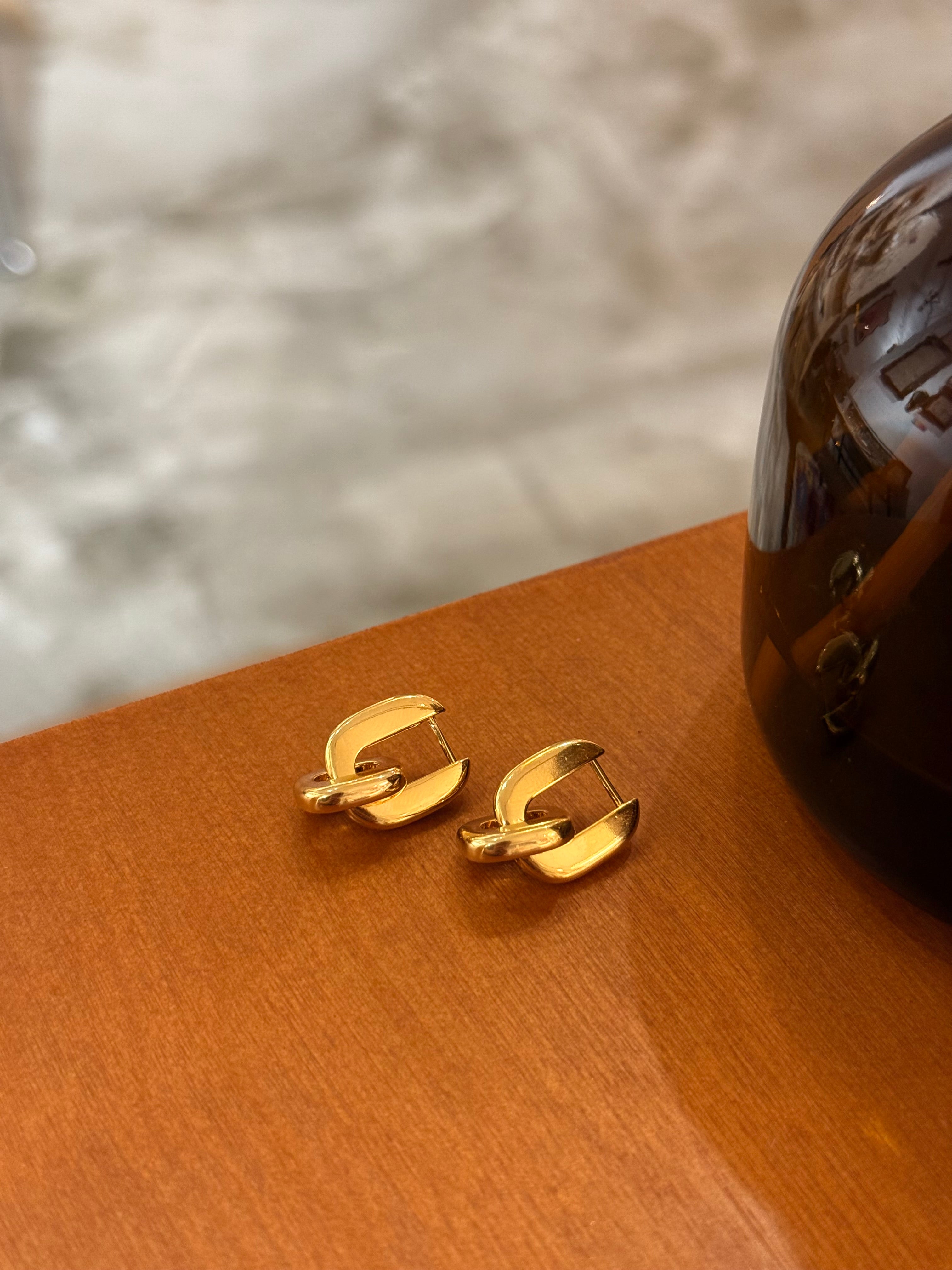 Interlock brass earrings