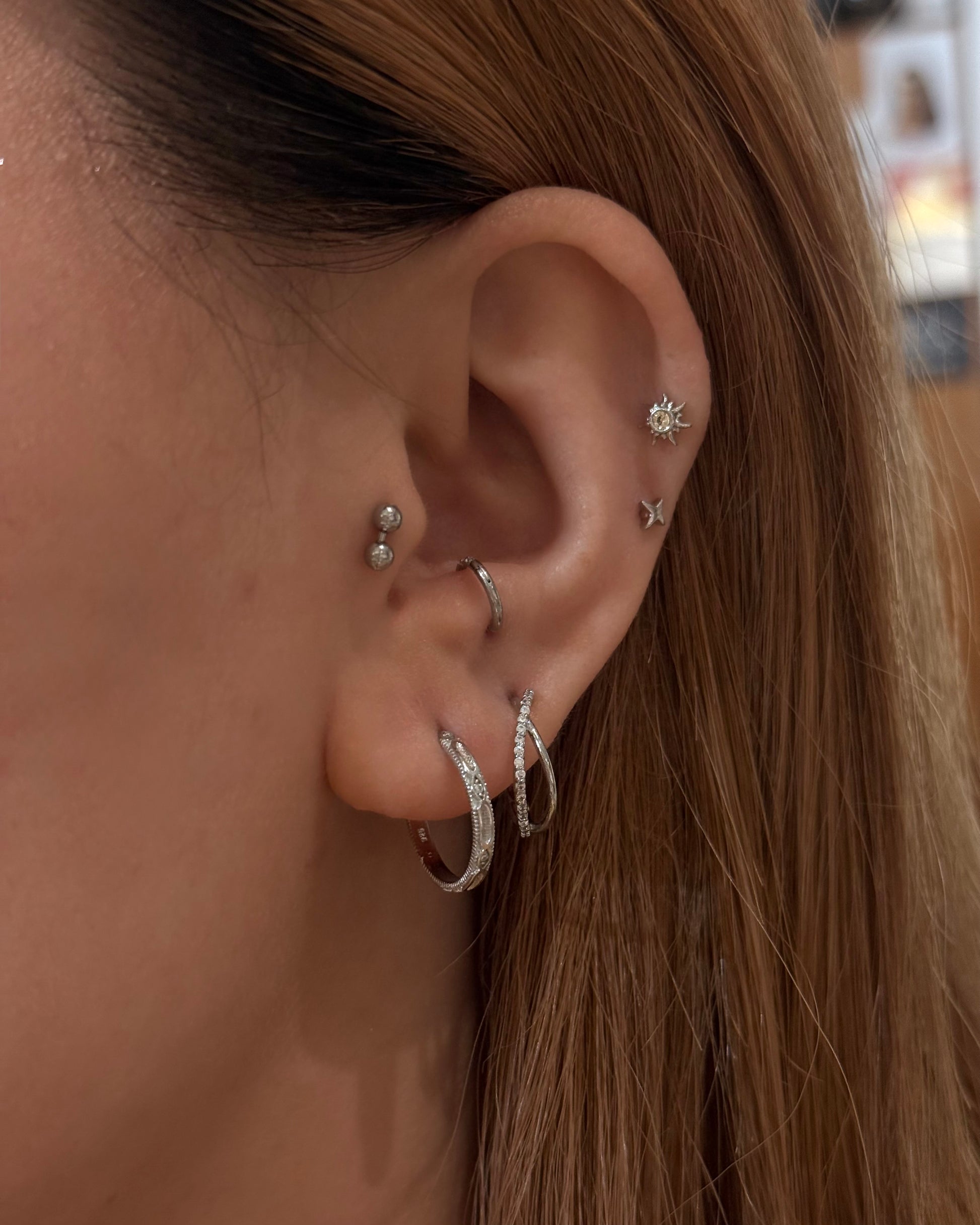 Double cross hinged hoop earrings