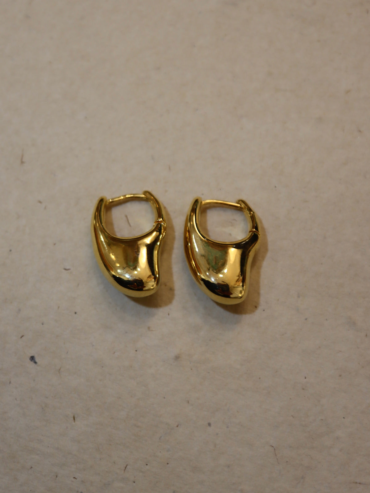 Irregular hoop brass earrings