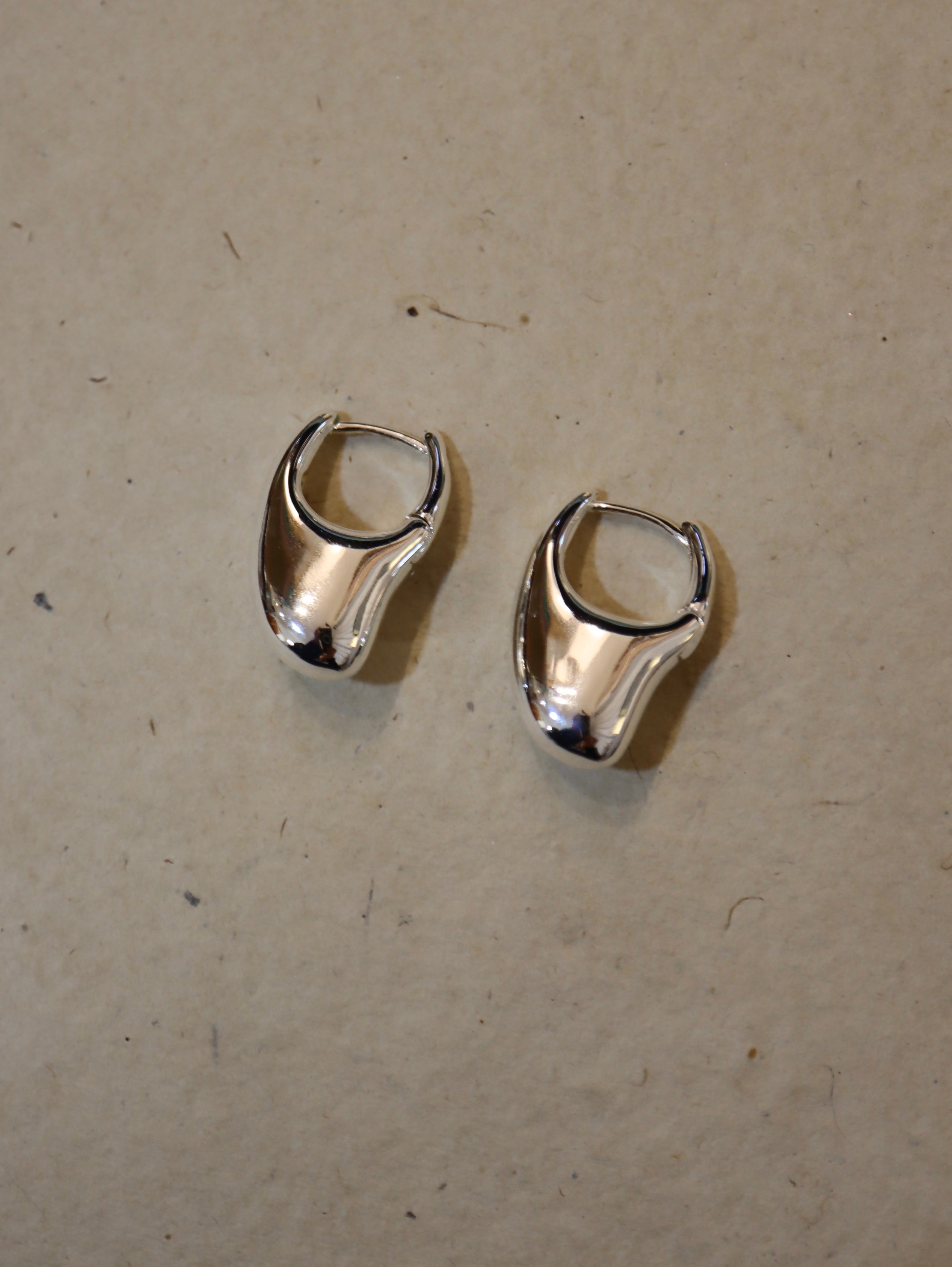 Irregular hoop brass earrings