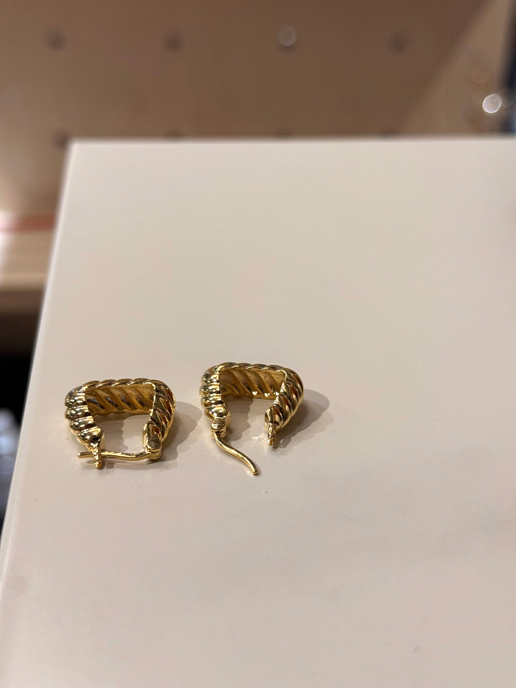 Golden twisted hoop earrings