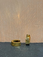 Surgical steel flat hinged hoop earrings