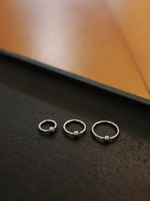 Surgical steel captive bead clicker