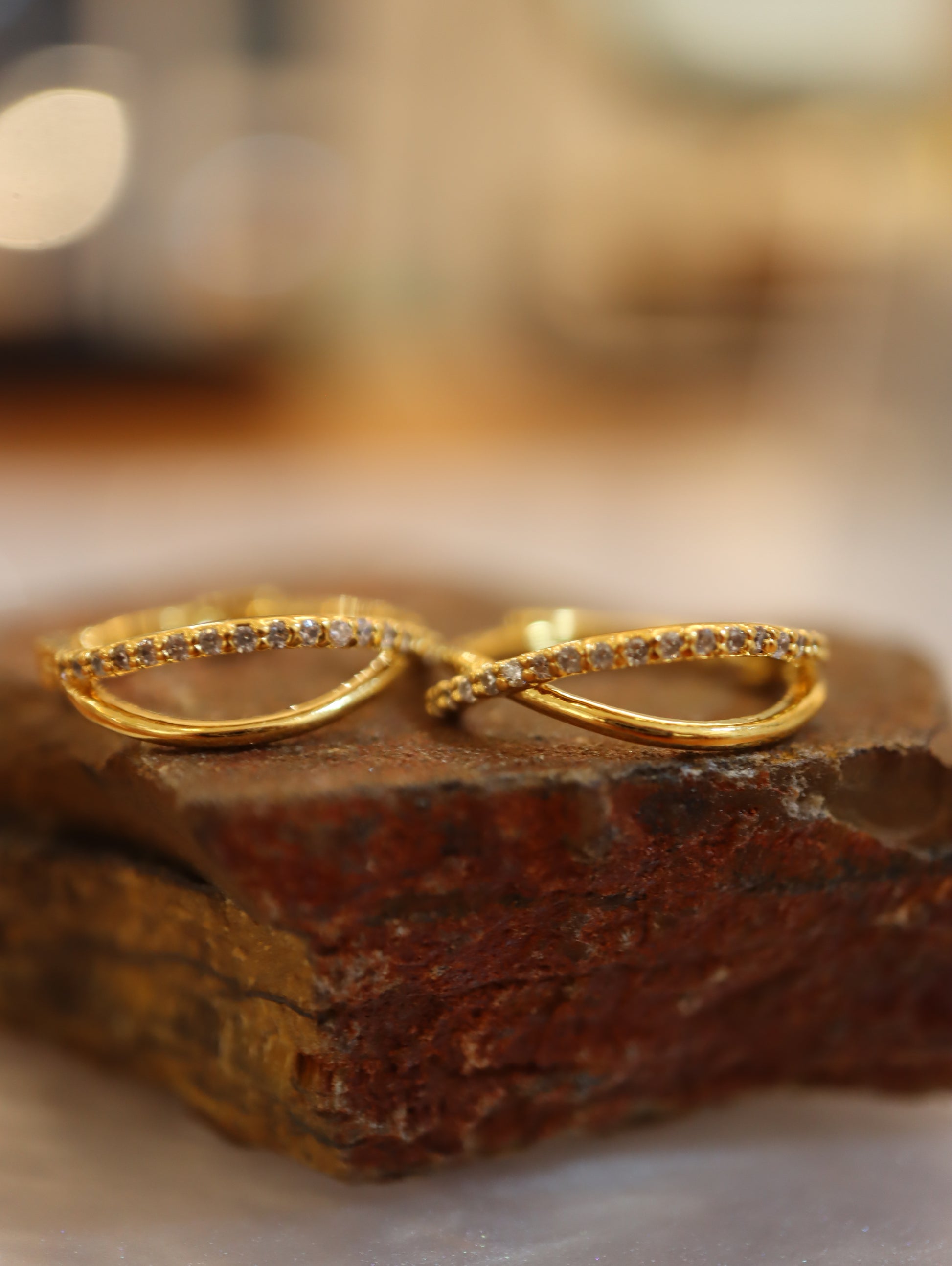 Double cross hinged hoop earrings