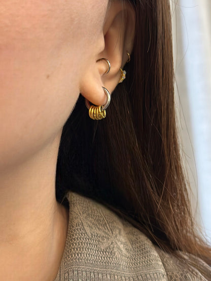 Mixed tone hoop interlock earrings