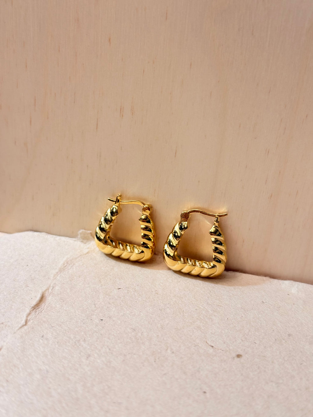 Golden twisted hoop earrings
