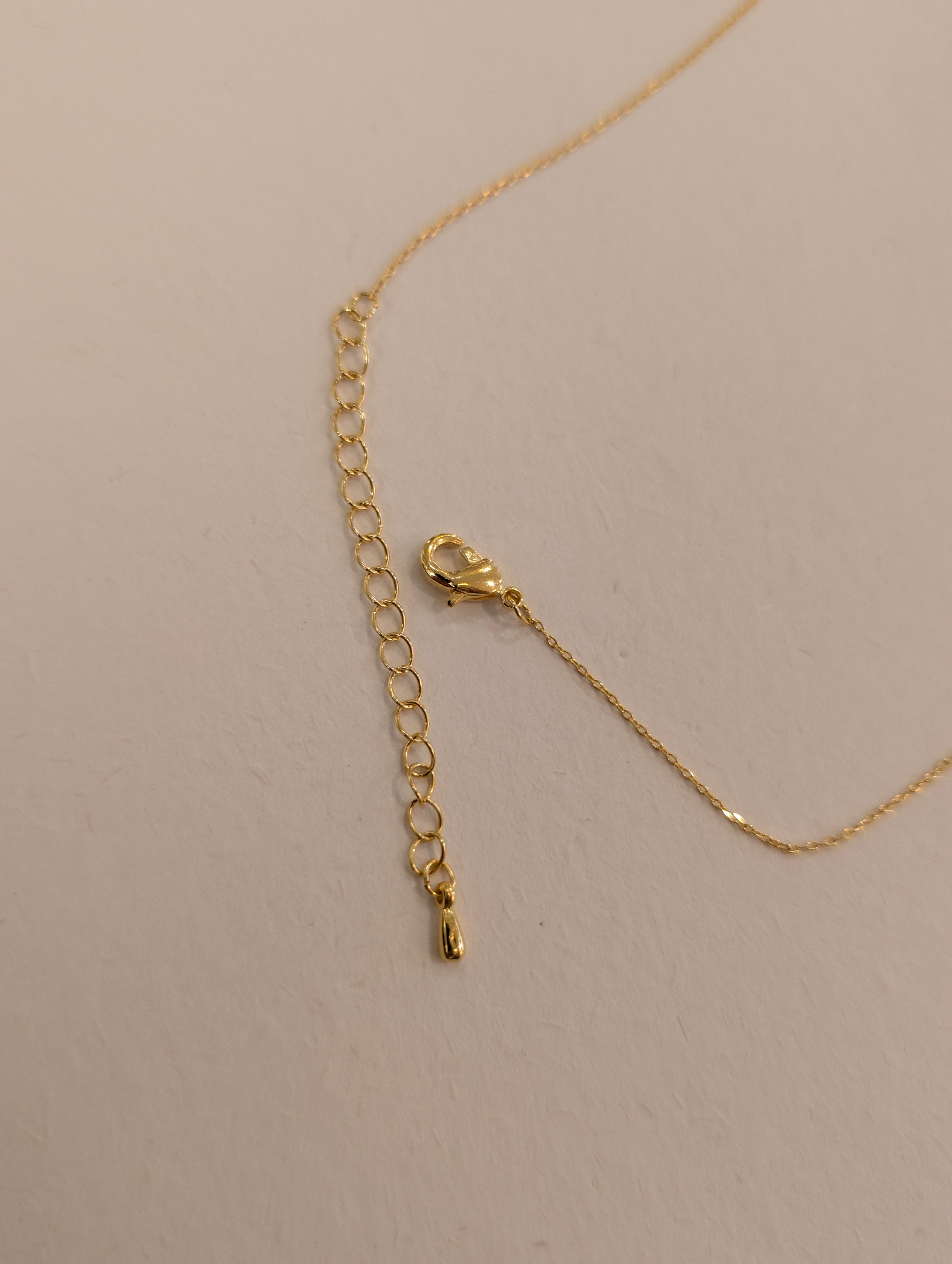 Crescent pearl brass necklace