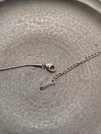 Crescent cz stud stainless steel necklace