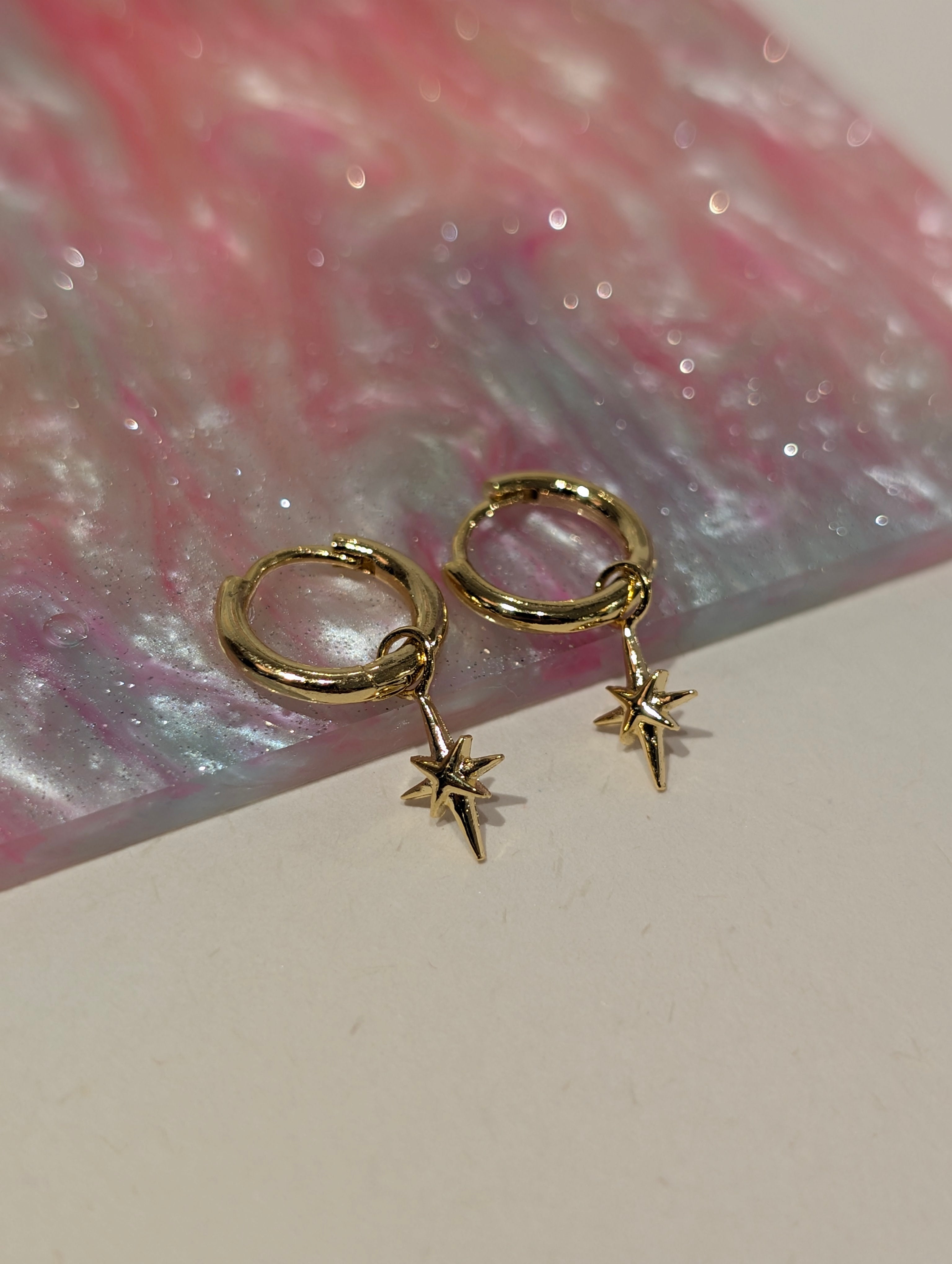 Hinged hoop drop starburst earrings