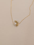 Crescent pearl brass necklace
