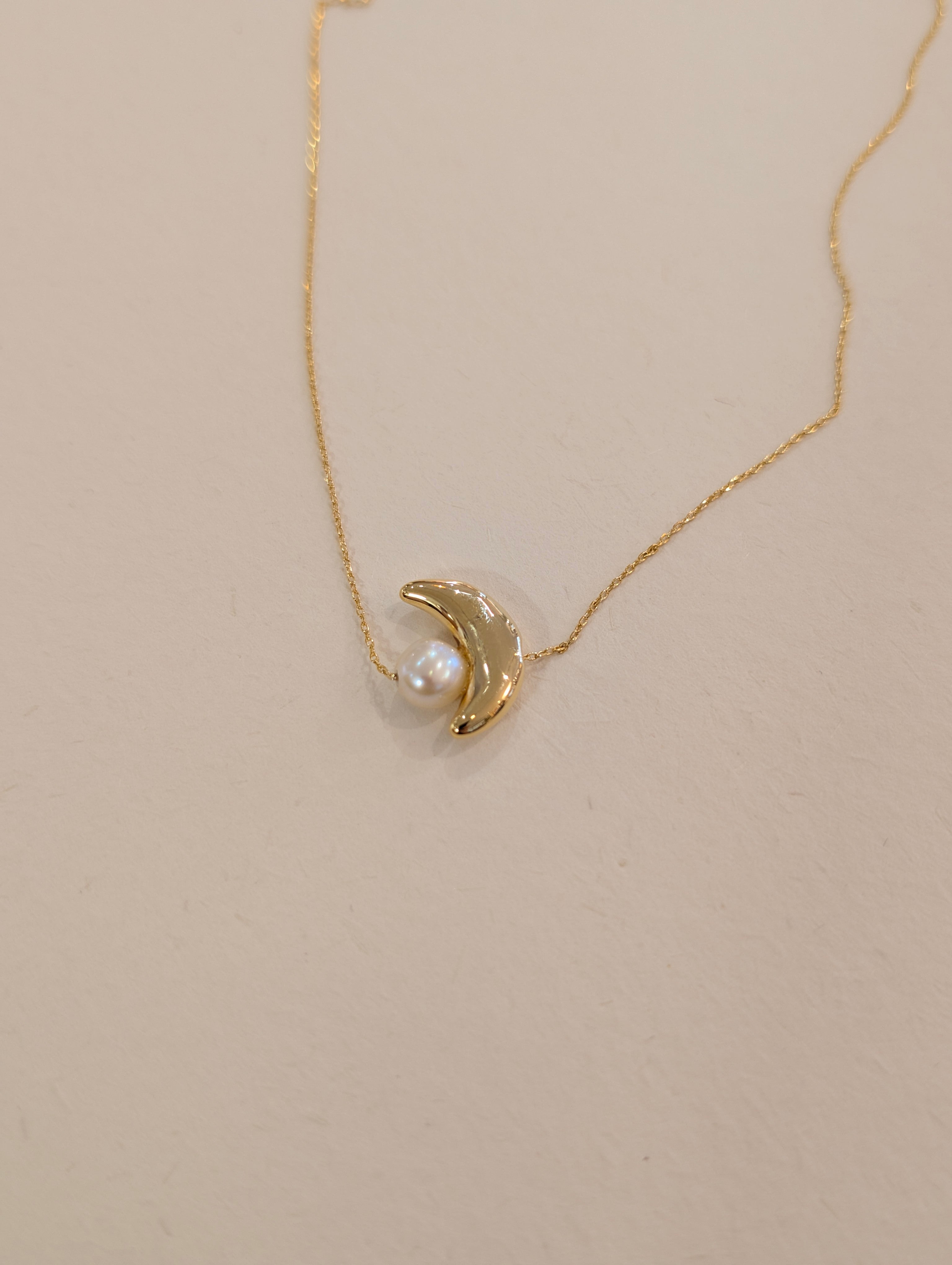 Crescent pearl brass necklace