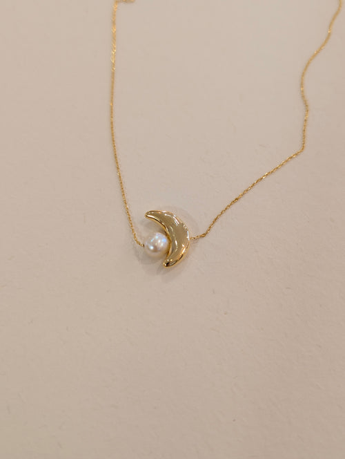Crescent pearl brass necklace