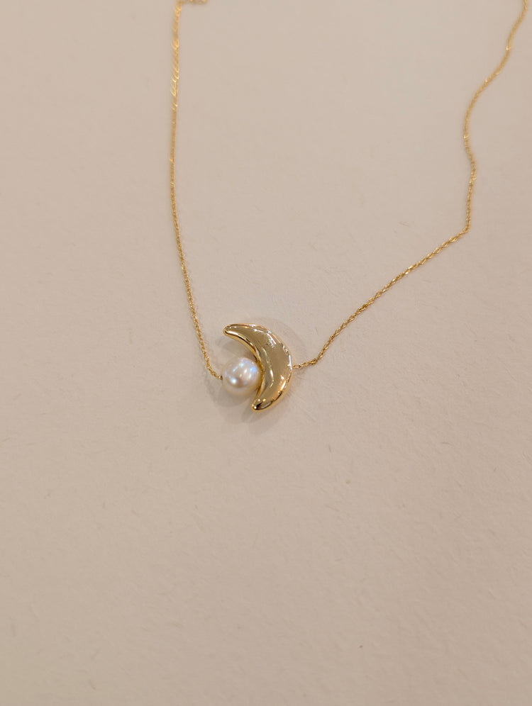Crescent pearl brass necklace