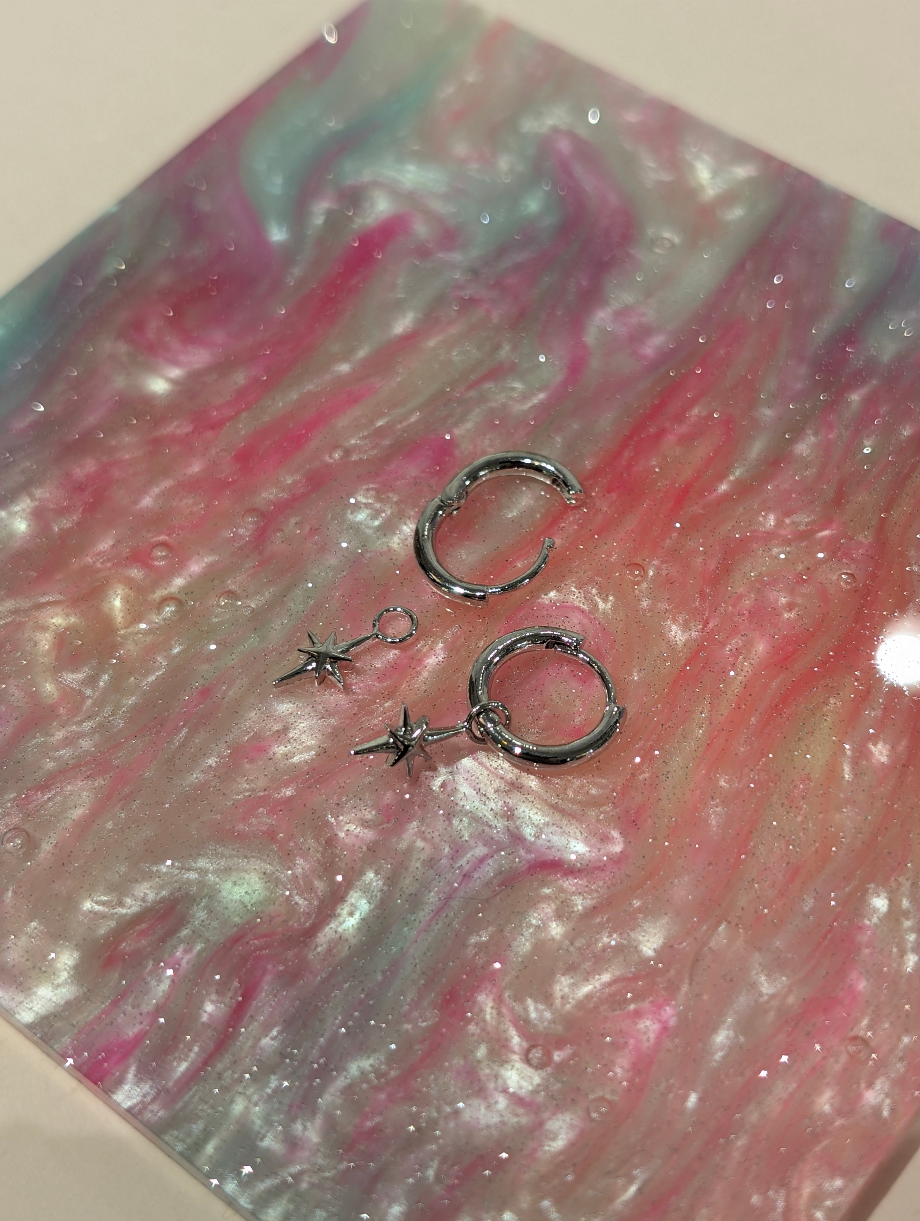 Hinged hoop drop starburst earrings